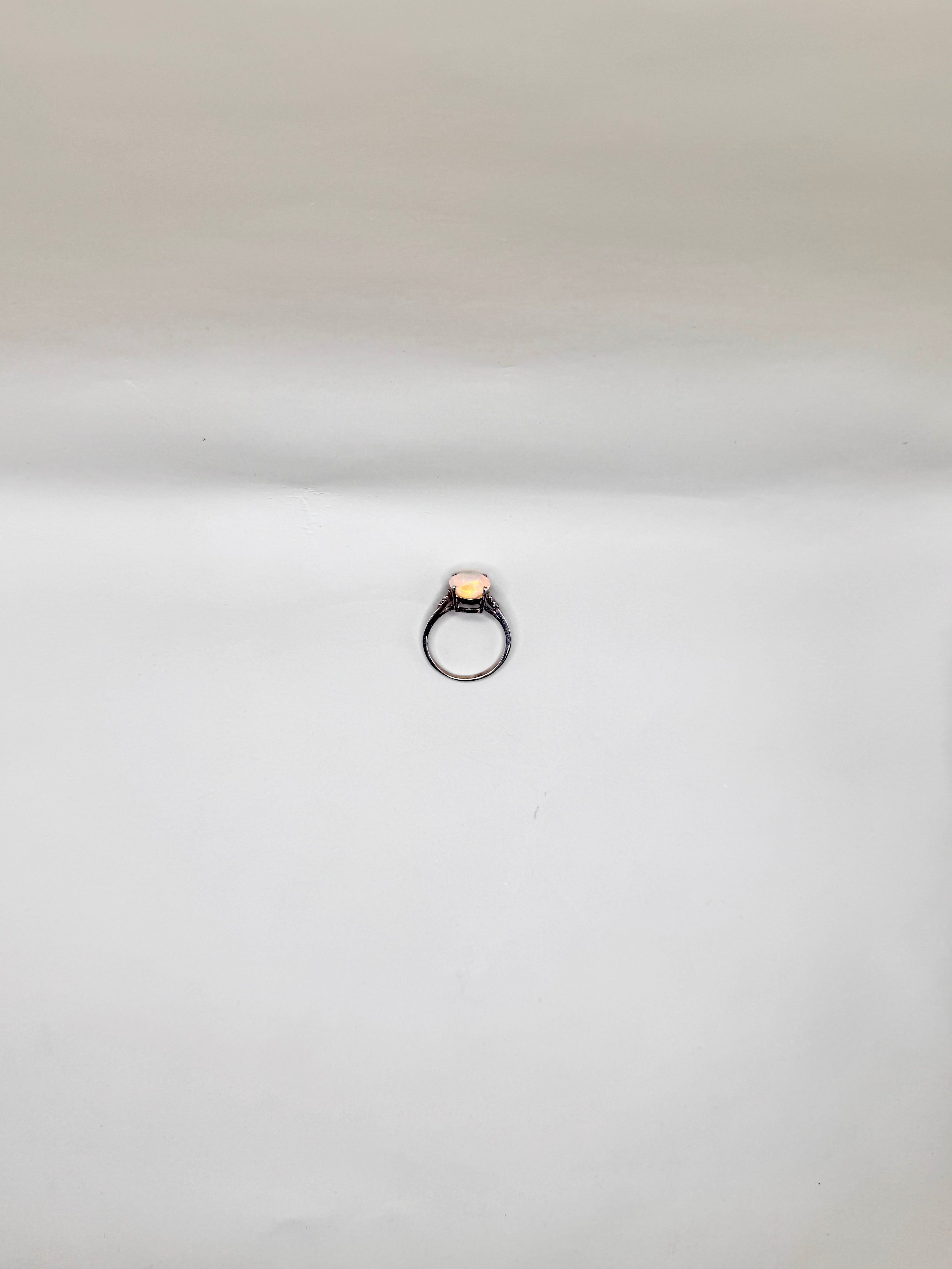 FIRE OPAL PEAR CUT AND DIAMONDS RING